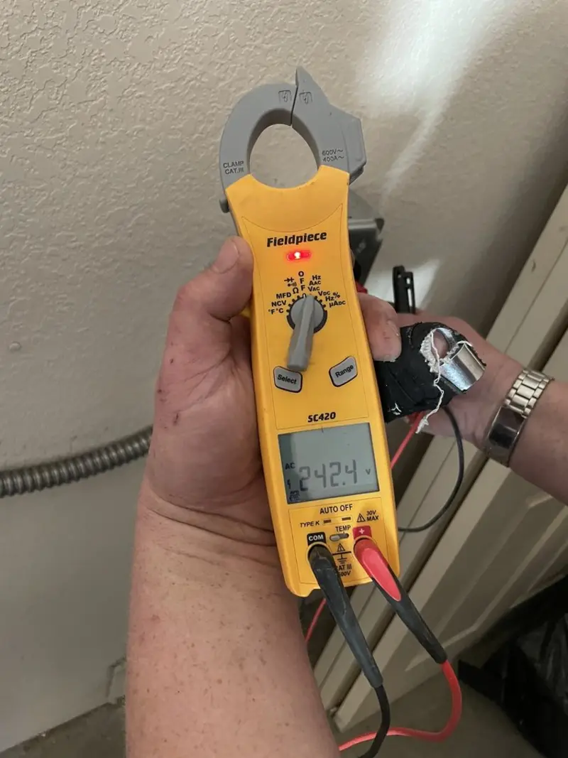 Voltage testing with clamp meter during Whole House Surge Protector in Garwood